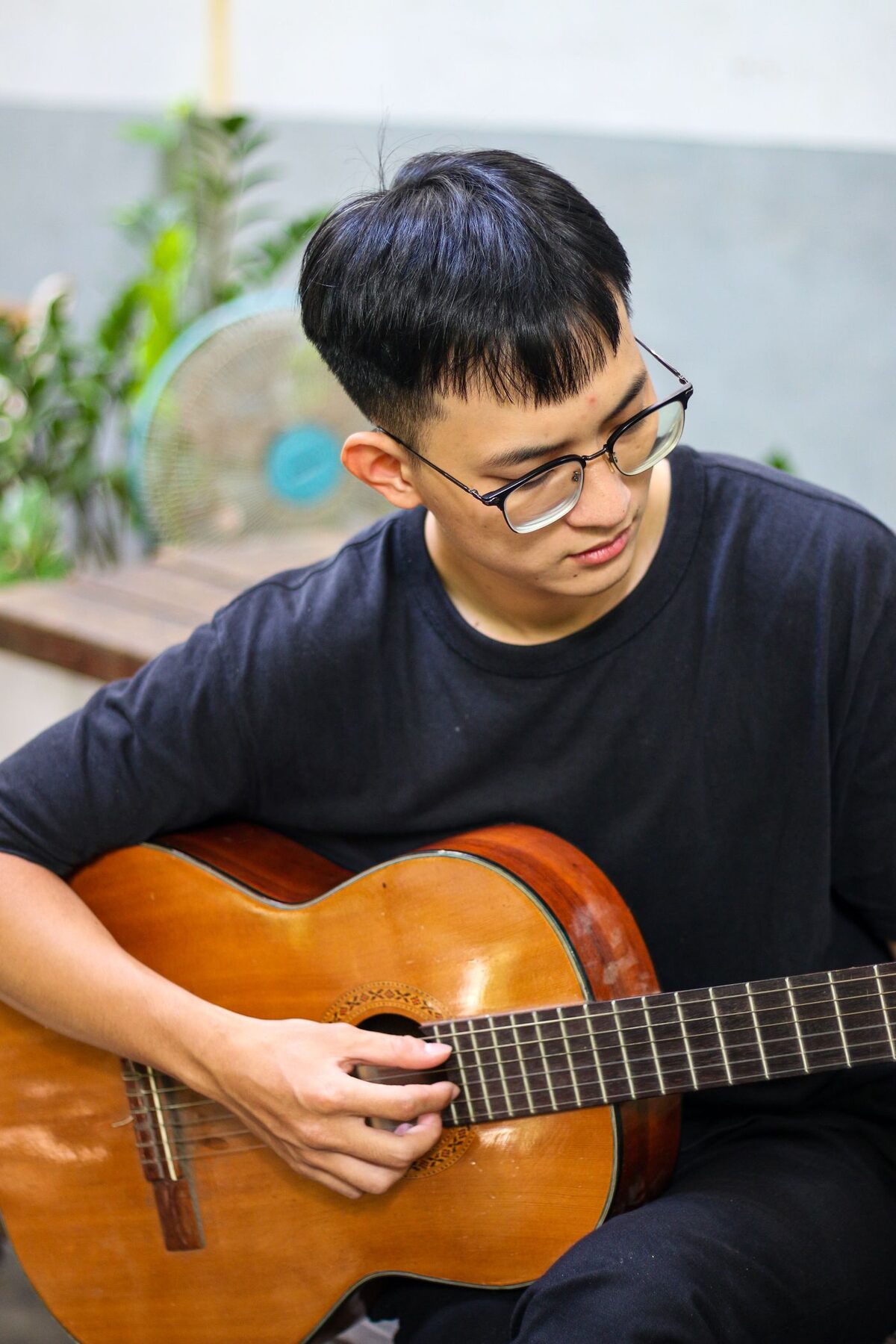Student practicing guitar