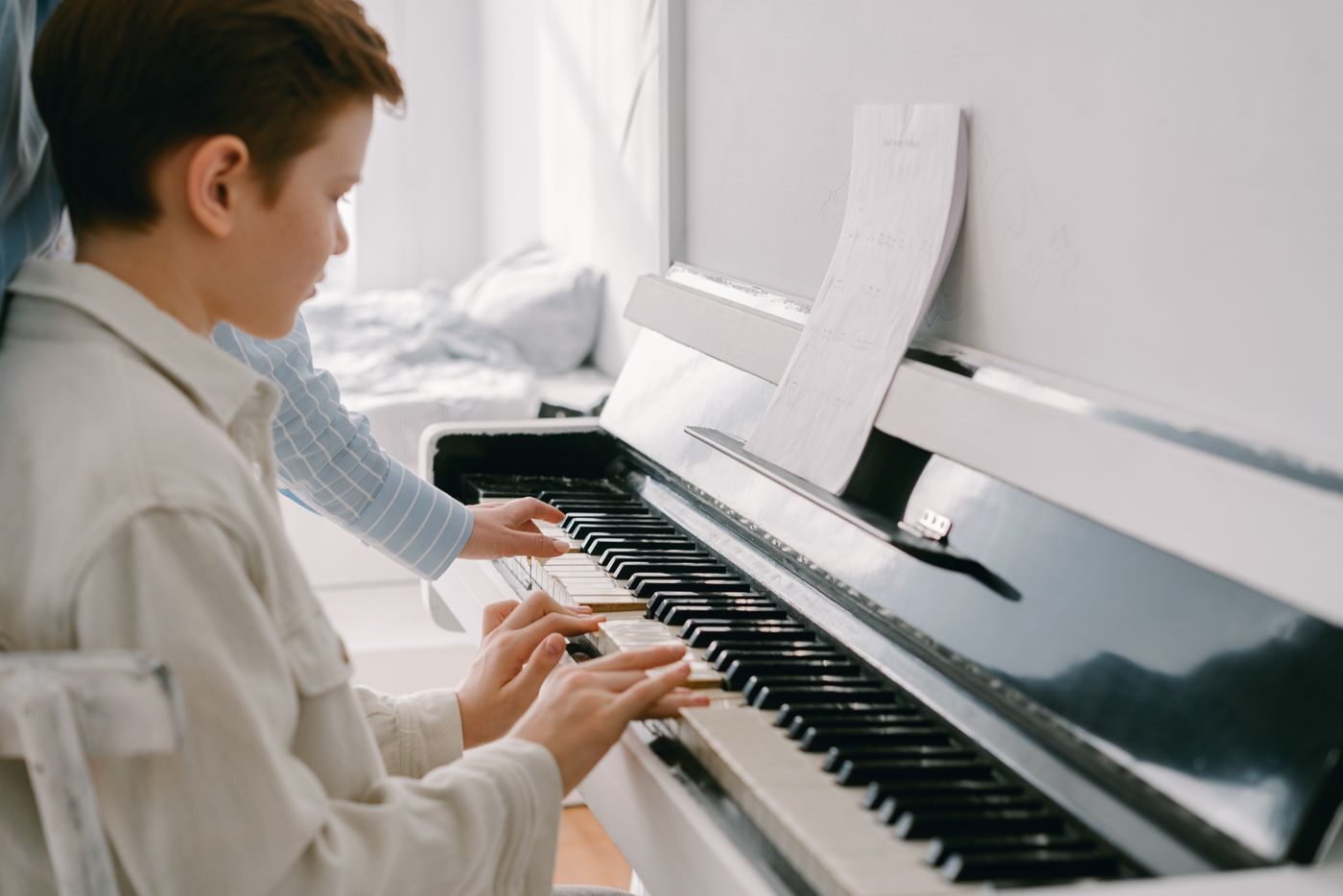 Student learning piano