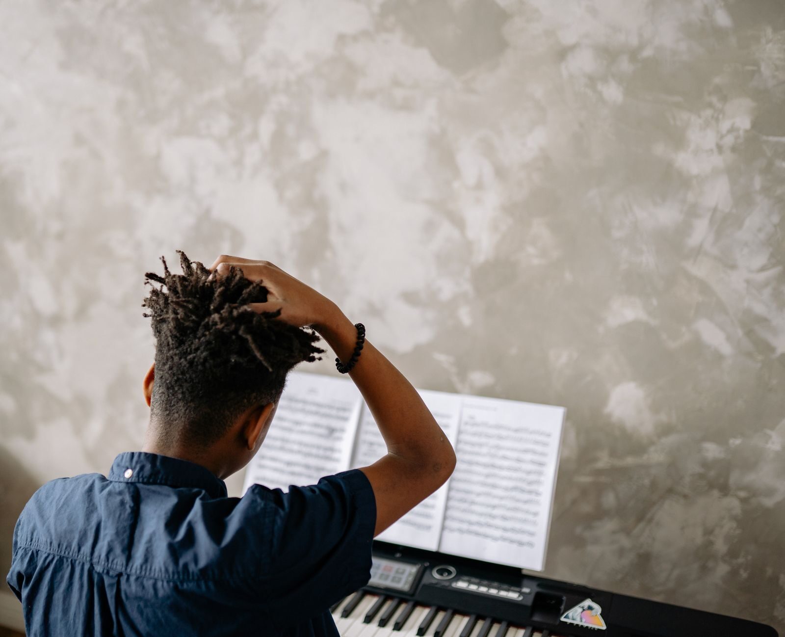 Young student playing piano