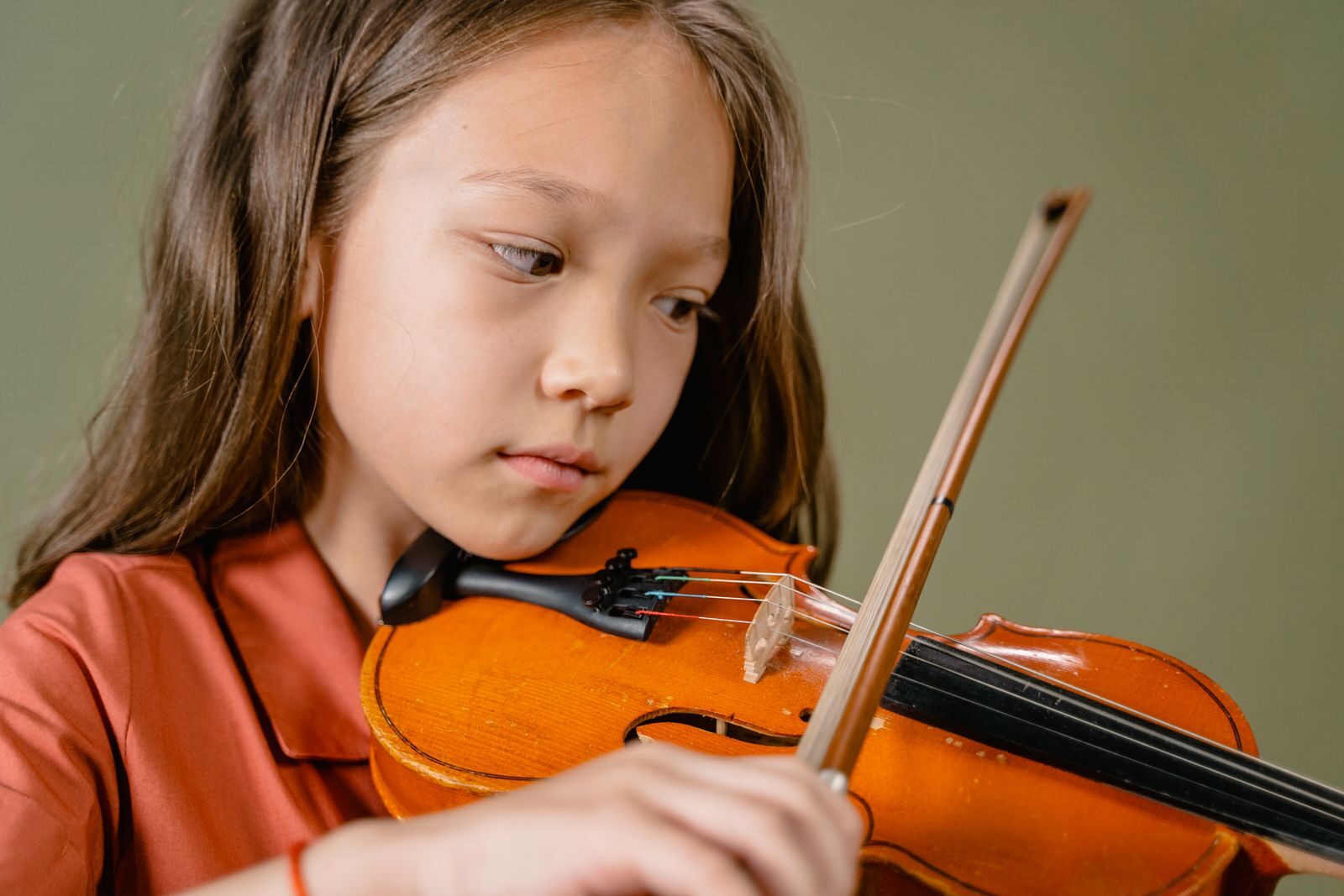 Young student playing violin