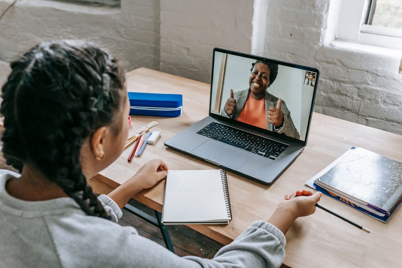 Student taking a live online music lesson via video call