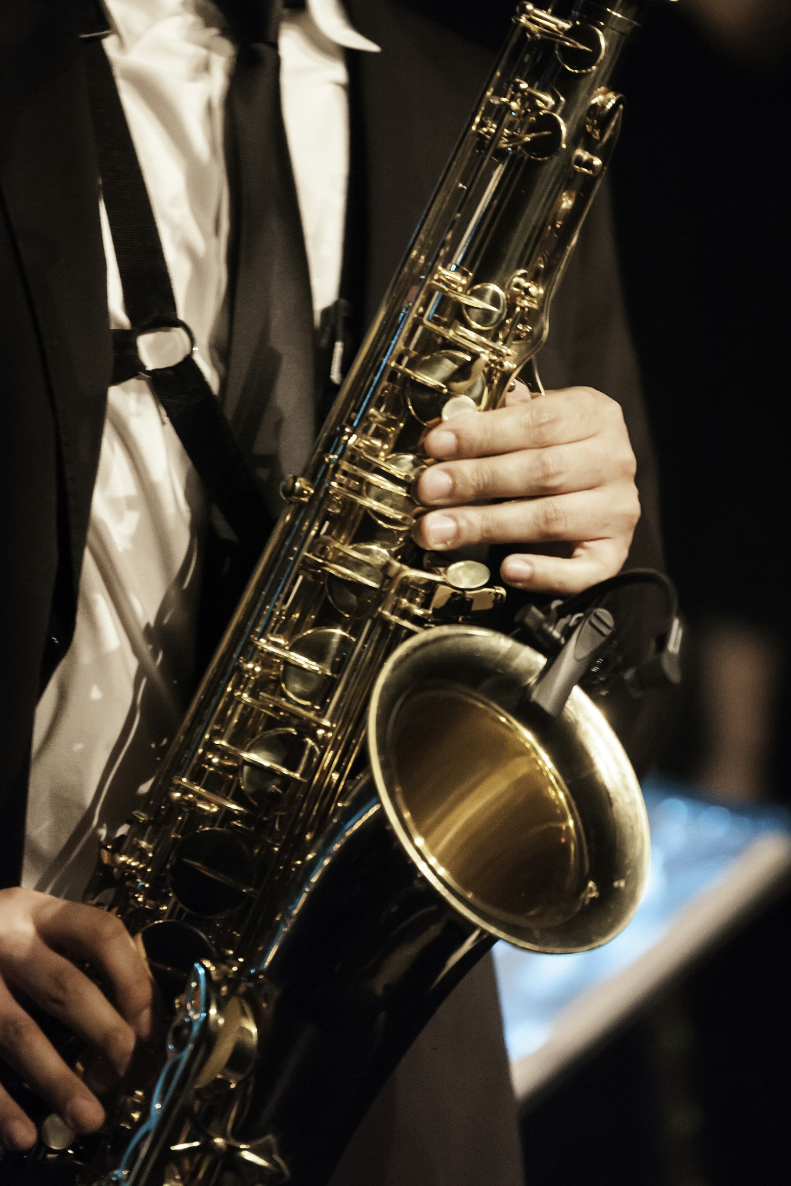 Saxophone player's hand on the keys mid-performance