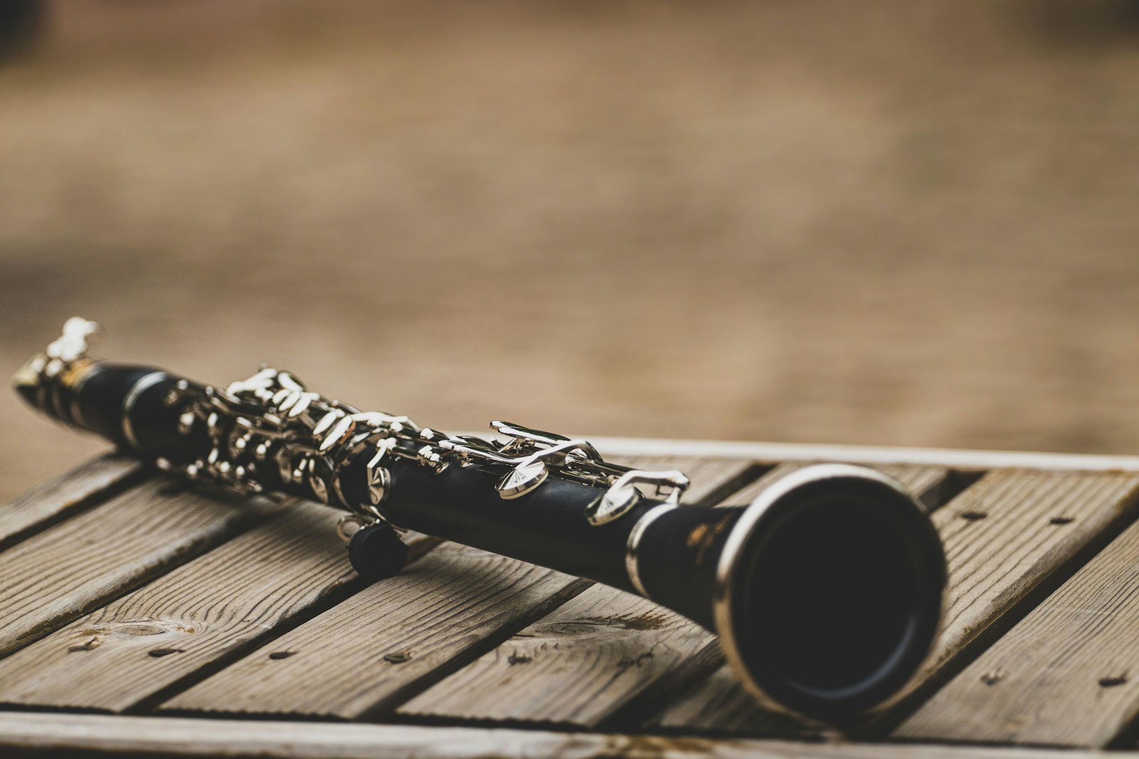 Clarinet resting on a wooden deck