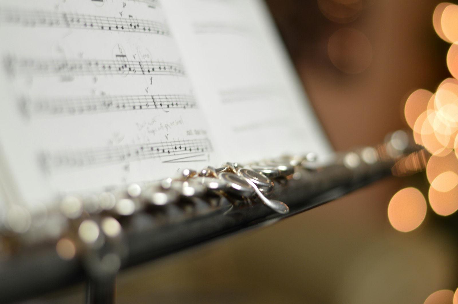 Flute resting on a music stand
